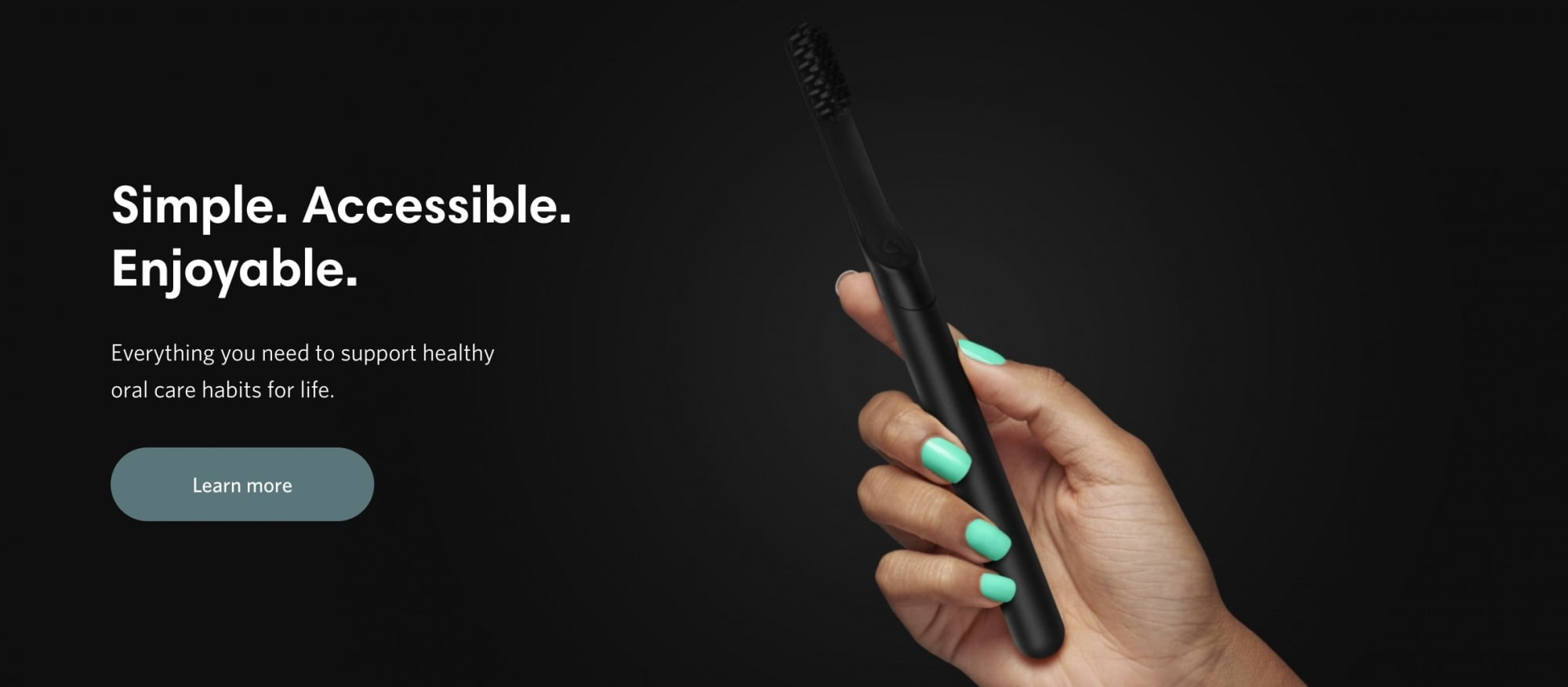 landing with a toothbrush in a hand heading and button lots of black space